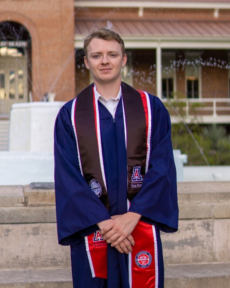 Calvin in his University of Arizona graduation gown at Old Main
