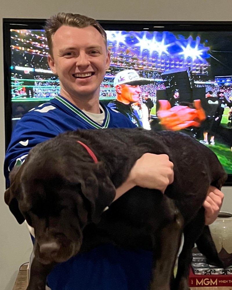 Calvin holding his dog, Ivy